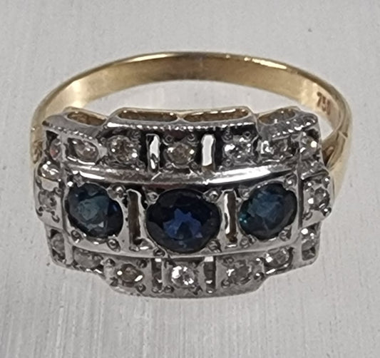 Blue sapphire with diamond ring set in white and yellow gold