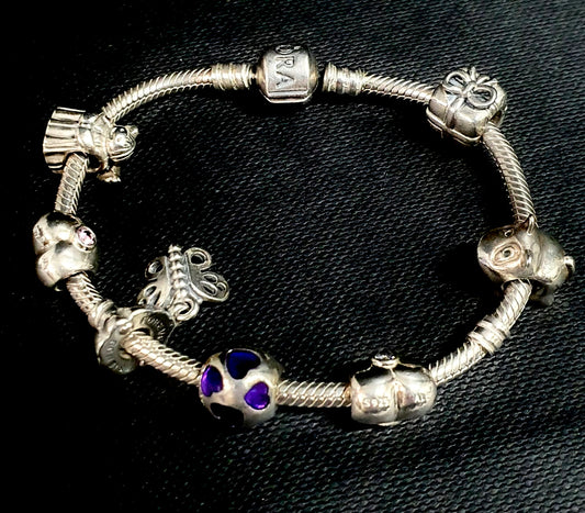 Authentic pandora bracelet with 7 charms