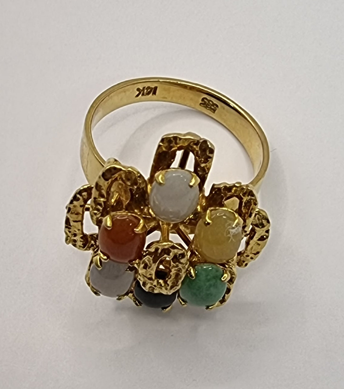 This stylish ring is made of 14ct yellow gold contains 6 multi coloured jade stone